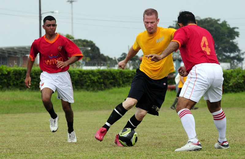 a defender jockeys an opposing player